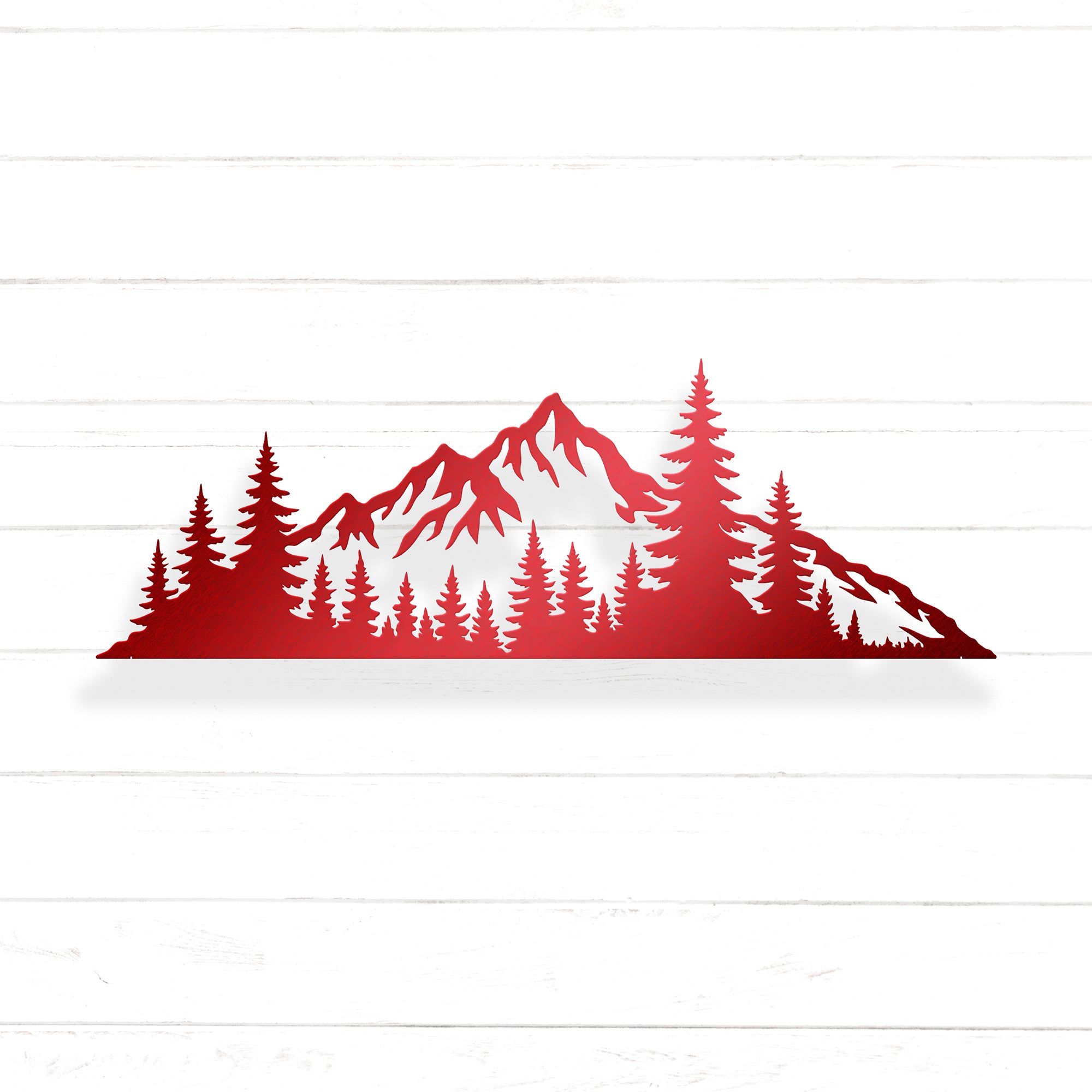 A red silhouette of a mountain range with pine trees in the foreground.