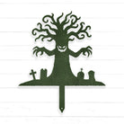 A silhouette of a tree with a face and hands, surrounded by cemetery-like elements such as crosses and gravestones.