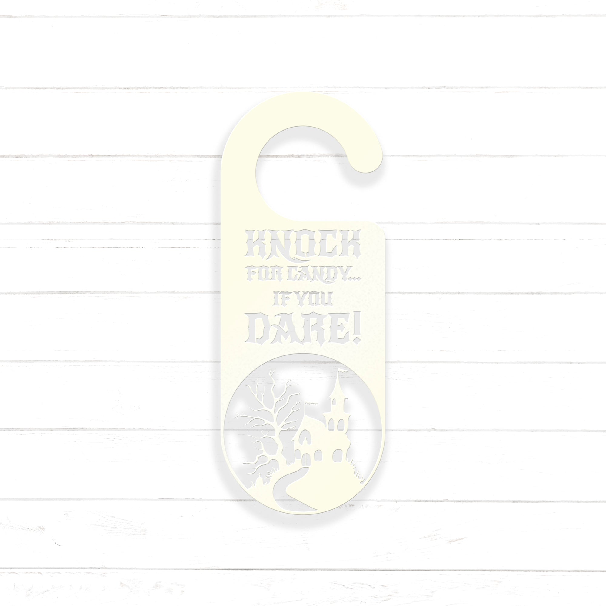 A white door hanger with a castle silhouette and the text "KNOCK FOR LADY... IF YOU DARE!" printed on it.